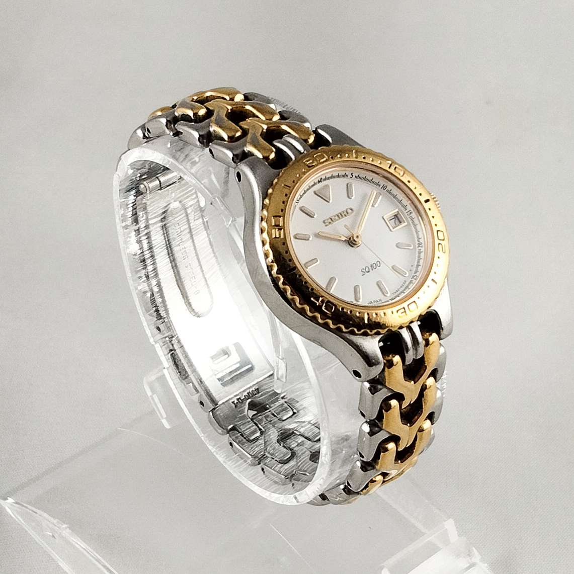 Seiko SQ 100 Silver and Gold Tone Watch, Date, Bracelet Strap