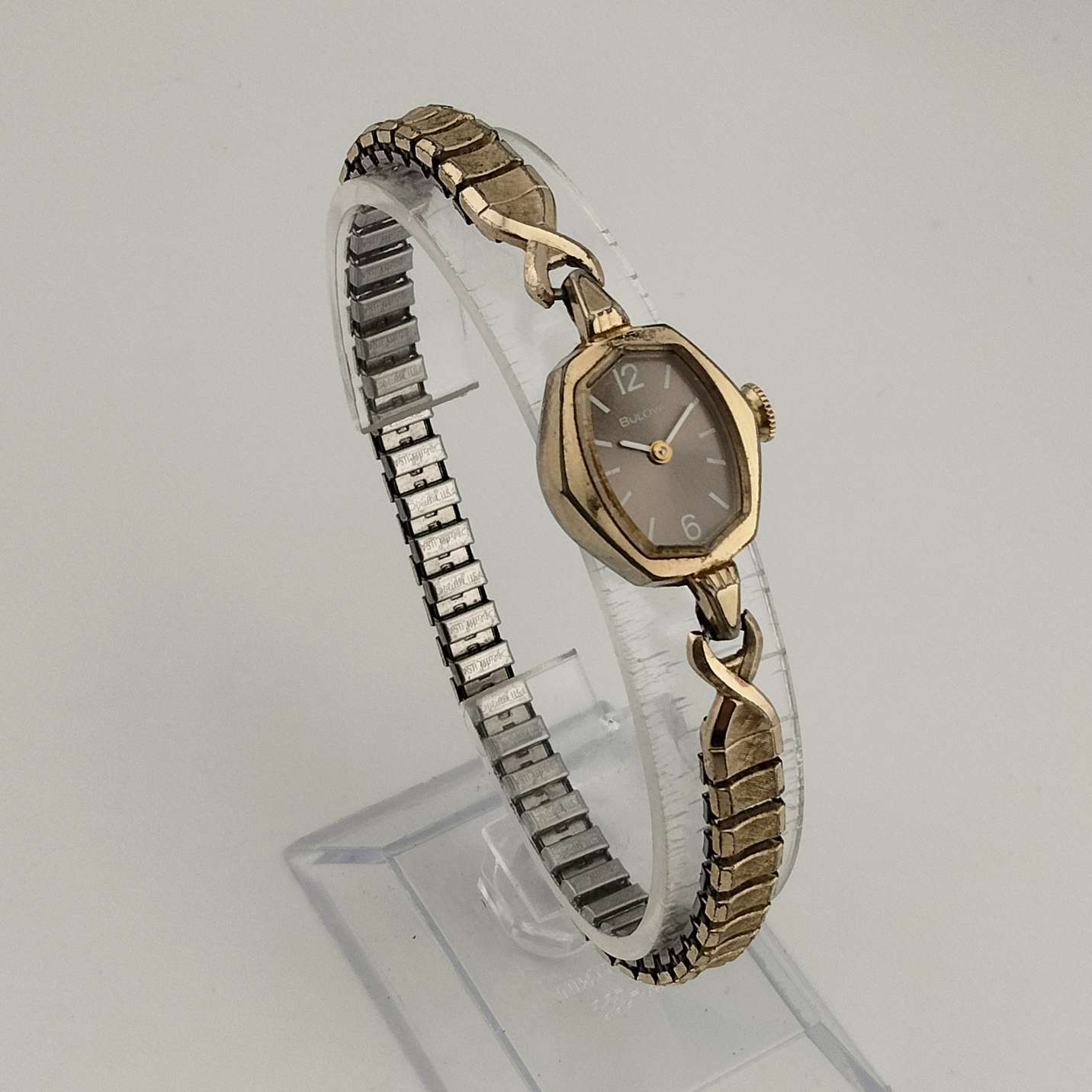 Bulova Petite Gold Tone Watch, Unique Polygonal Oval Dial, Stretch Strap