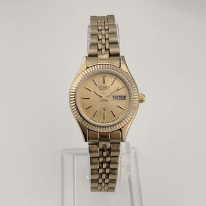 Citizen Unisex Gold Tone Watch, Round Dial, Date and Day Window, Bracelet Strap