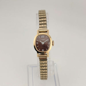 Timex Unisex Gold Tone Watch, Brown Oval Dial, Stretch Strap