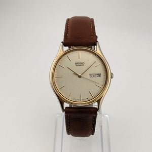 Seiko Unisex Gold Tone Watch, Circular Dial, Date and Day Window, Brown Genuine Leather Strap