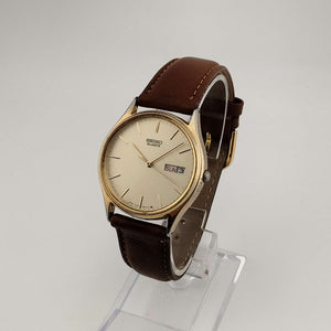 Seiko Unisex Gold Tone Watch, Circular Dial, Date and Day Window, Brown Genuine Leather Strap