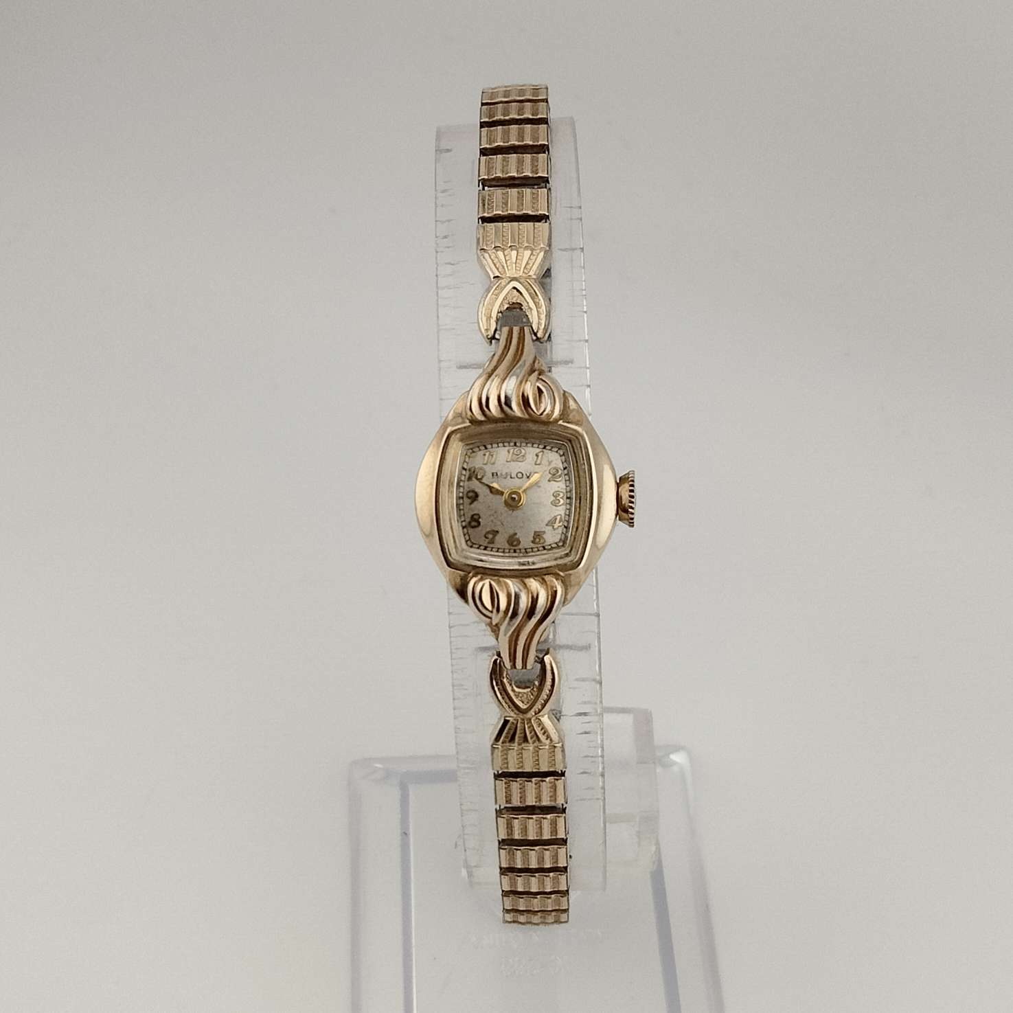 Bulova Petite Gold Tone Watch, Unique Square Dial with Rounded Sides, Stretch Strap