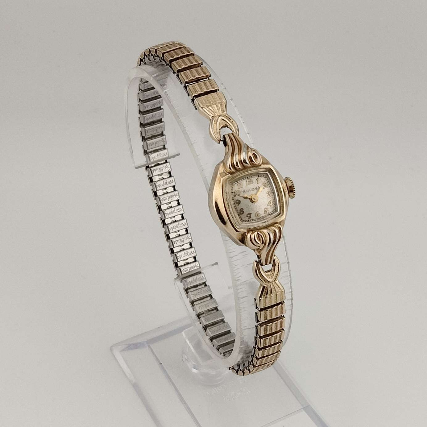 Bulova Petite Gold Tone Watch, Unique Square Dial with Rounded Sides, Stretch Strap