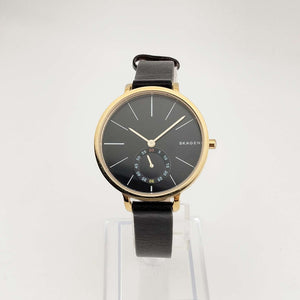 Skagen Unisex Gold Tone Watch, Round Black Chronograph Dial, Genuine Black Leather Strap