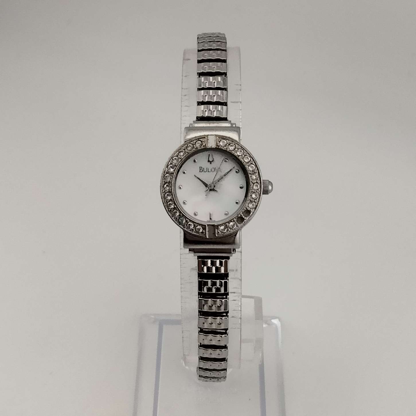 Bulova Women's Silver Tone Watch, Circular Mother of Pearl Dial, Jeweled Bezel, Stretch Strap