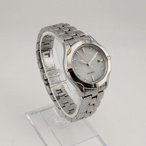 Citizen Unisex Silver Tone Eco-Drive Watch, Gold Tone and Jewel Details, Date Window, Bracelet Strap