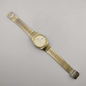 Seiko Unisex Gold Tone Quartz Watch, Circular Dial, Date and Day Window, Adjustable Link Strap