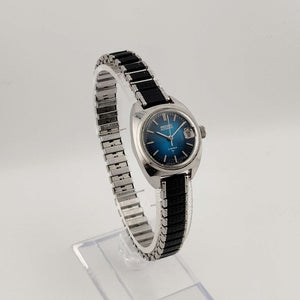 Seiko Silver Tone Automatic Watch, Circular Blue Dial, Date Window with Magnifying Detail, Stretch Strap