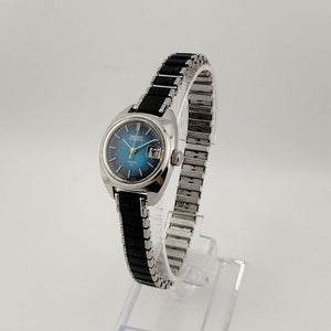 Seiko Silver Tone Automatic Watch, Circular Blue Dial, Date Window with Magnifying Detail, Stretch Strap