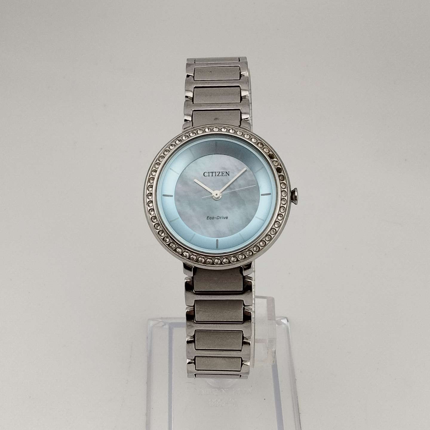 Citizen Women's Silver Tone Eco-Drive Watch, Circular Blue Mother of Pearl Dial, Jewel Tone Details, Link Strap