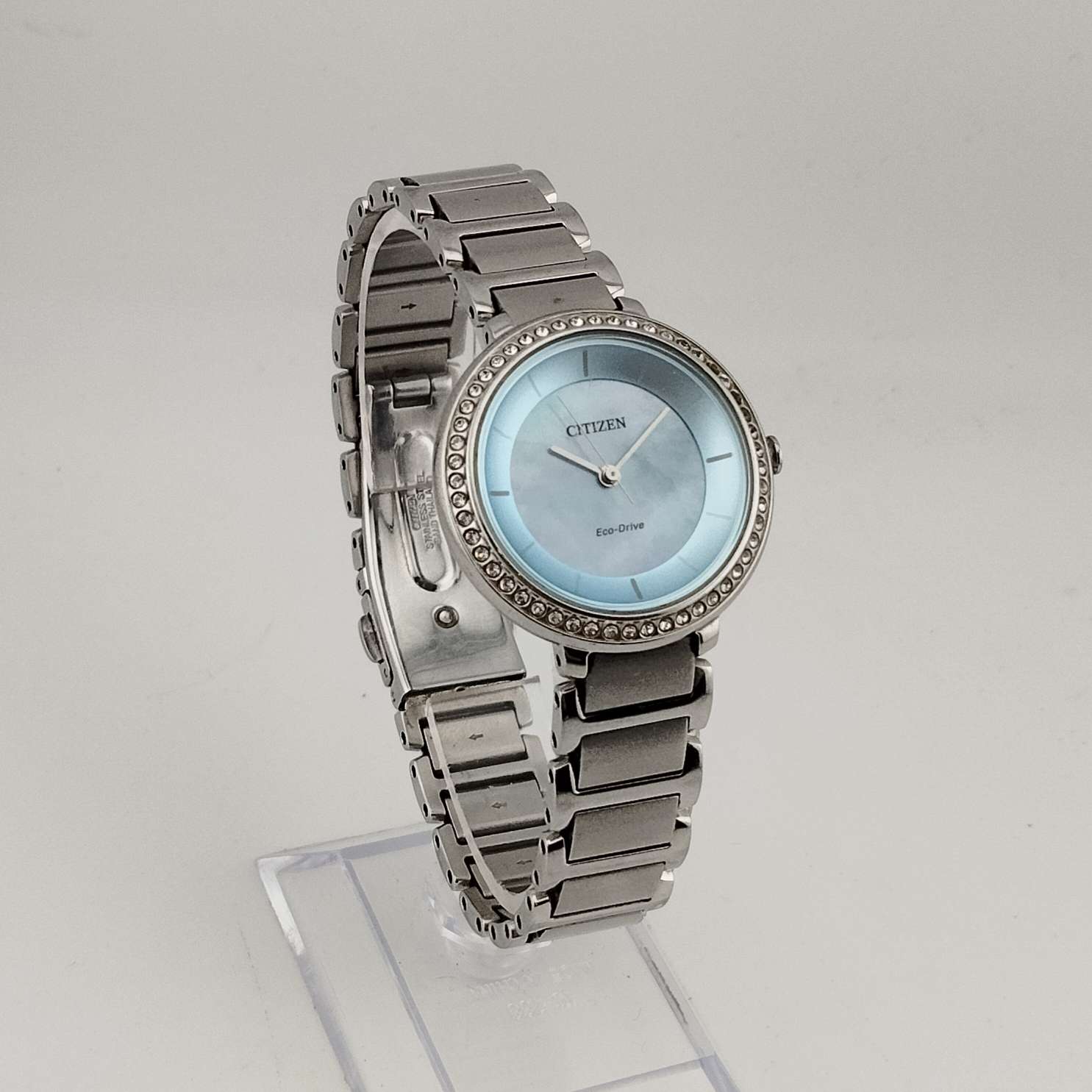 Citizen Women's Silver Tone Eco-Drive Watch, Circular Blue Mother of Pearl Dial, Jewel Tone Details, Link Strap