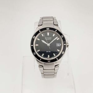 Citizen Men's Silver Tone Quartz Watch, Circular Black Dial, Date Window, Bezel Detail, Bracelet Strap