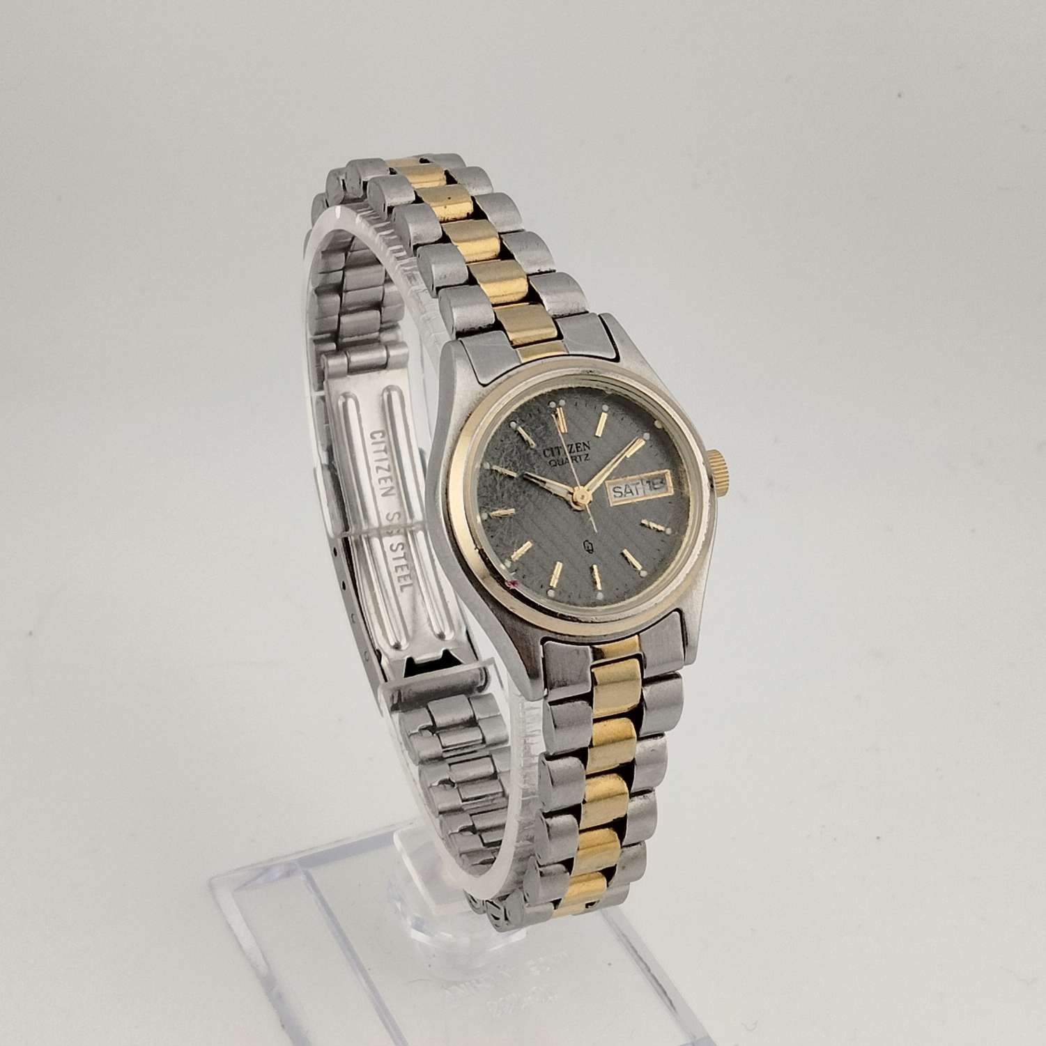 Citizen Men's Silver Tone Quartz Watch, Gold Tone Accents, Round Grey Dial, Date and Day Window, Bracelet Strap