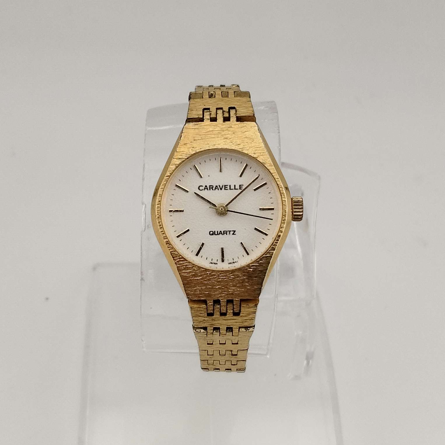 Caravelle by Bulova Women's Gold Tone Quartz Watch, White Round Dial, Bracelet Strap