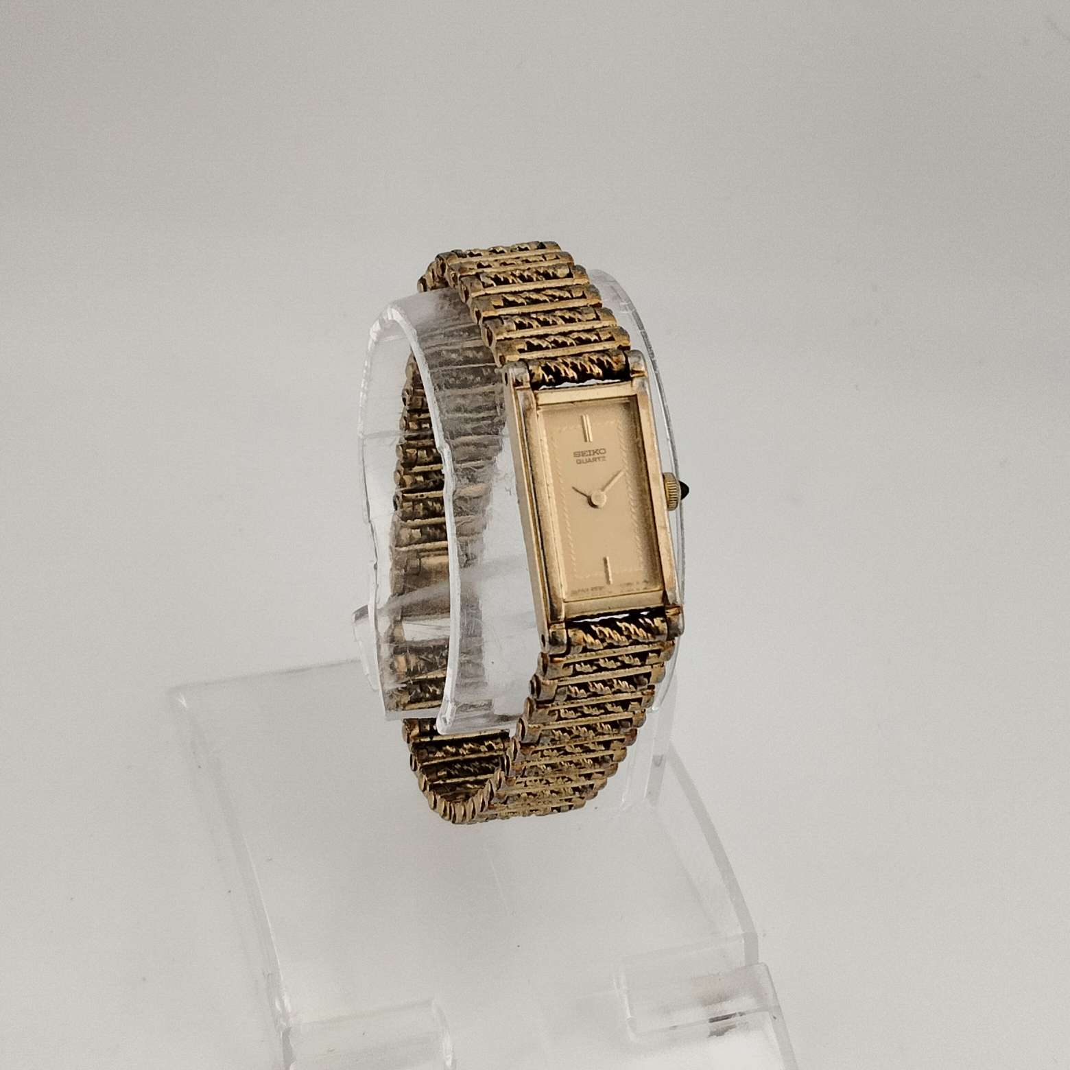 Seiko Women's All Gold Tone Quartz Watch, Elongated Rectangular Dial, Rope Detail on Face, Bracelet Strap