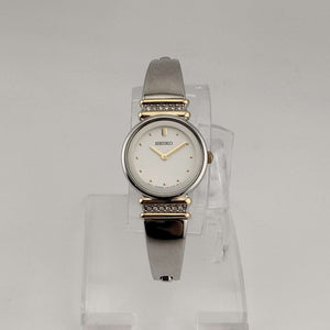 Seiko Women's Silver Tone Watch, Gold Tone Details, Round White Face, Jewel Bezel Details, Bracelet Strap