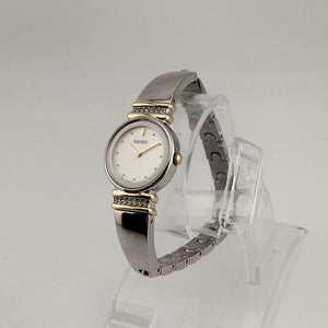 Seiko Women's Silver Tone Watch, Gold Tone Details, Round White Face, Jewel Bezel Details, Bracelet Strap