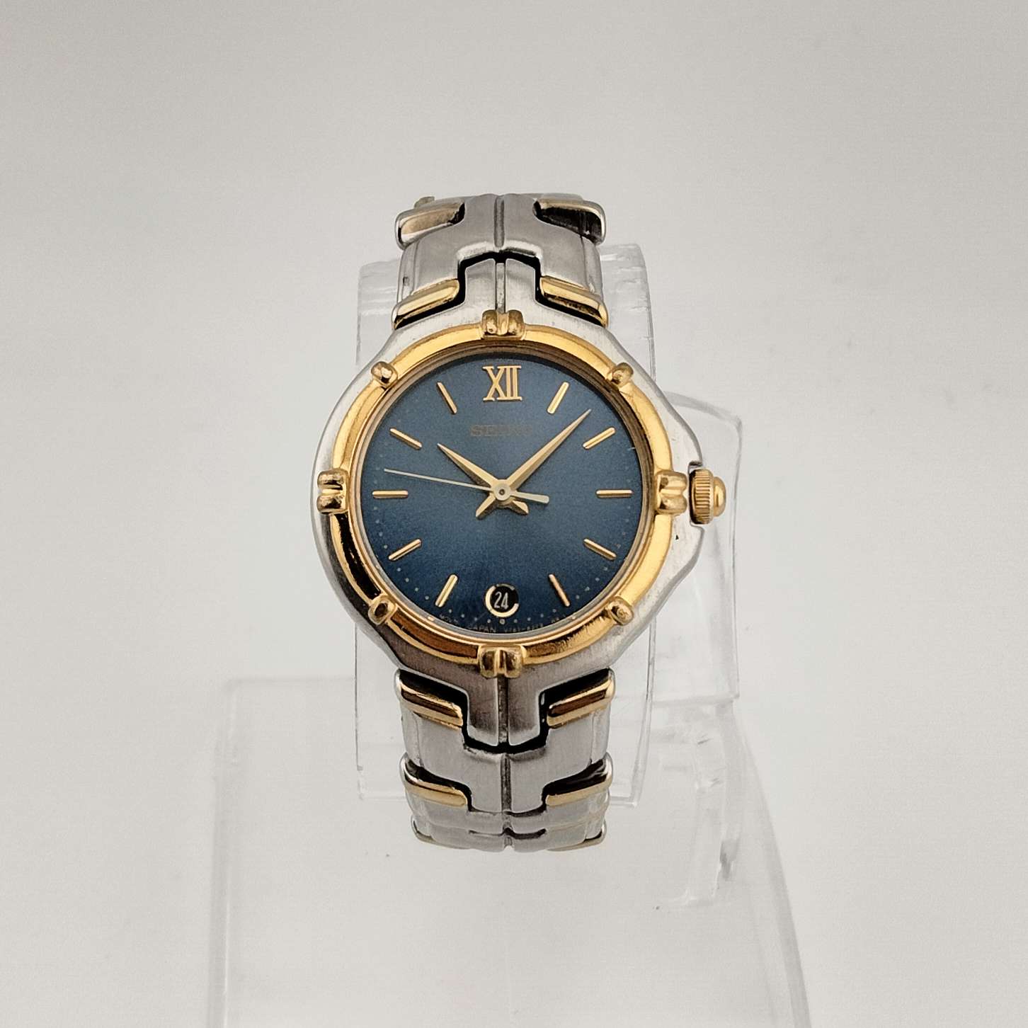 Seiko Silver Tone Watch, Gold Tone Accents, Round Blue Dial, Date Window, Bezel Detail, Bracelet Strap