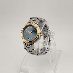 Seiko Silver Tone Watch, Gold Tone Accents, Round Blue Dial, Date Window, Bezel Detail, Bracelet Strap